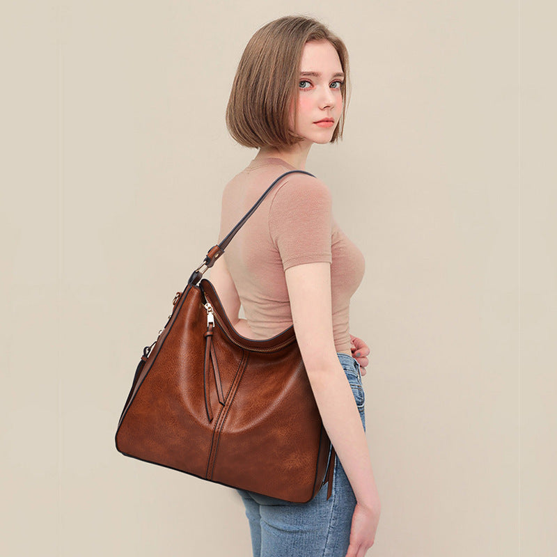 De Belgravia kunstleren vintage schoudertas en etui
