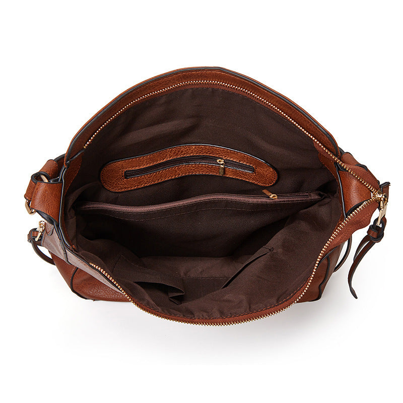 De Belgravia kunstleren vintage schoudertas en etui