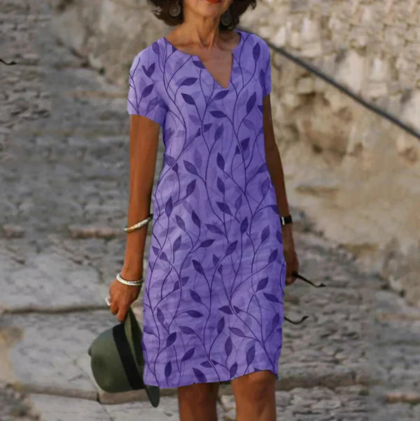 Dames mini-jurk met korte mouwen en bladprint 4