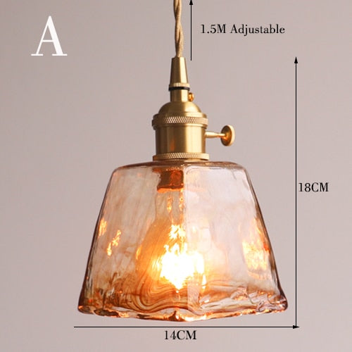 Hanglamp van messing en amberglas