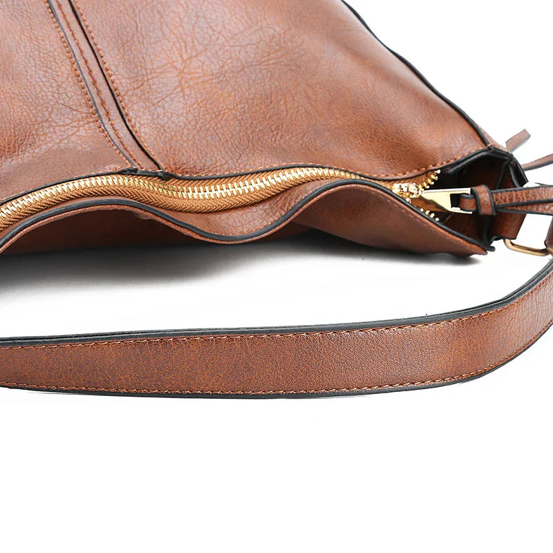 De Belgravia kunstleren vintage schoudertas en etui