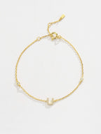 Elegante zirconium en sterling zilveren armband met gouden accenten