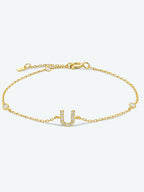 Elegante zirconium en sterling zilveren armband met gouden accenten