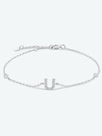 Elegante zirconium en sterling zilveren armband met gouden accenten