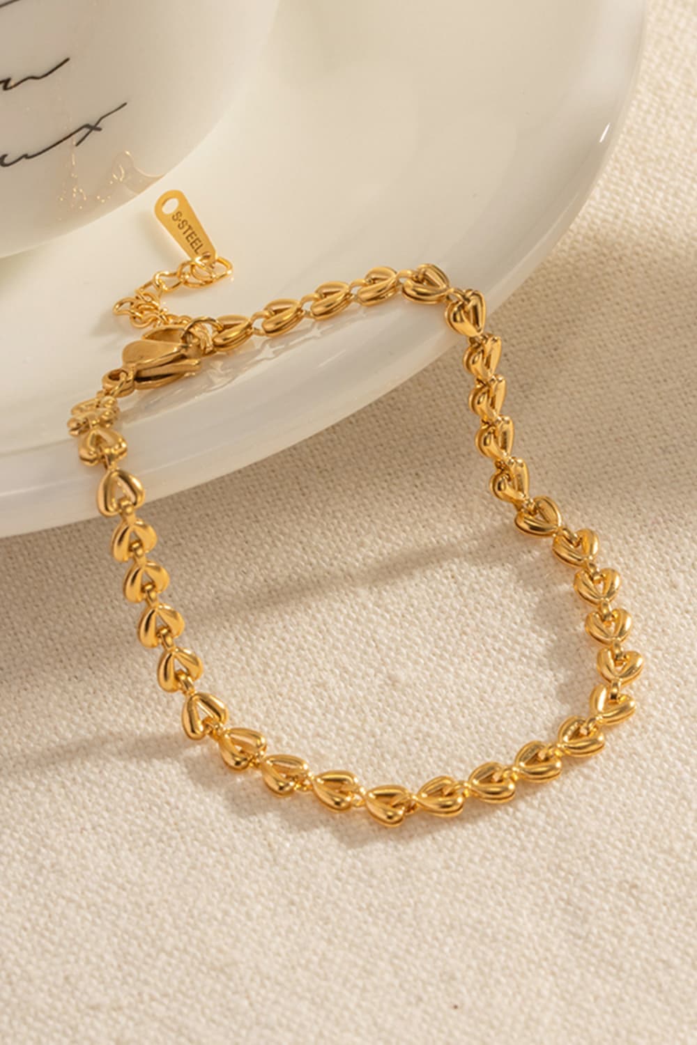 Hartverwarmende armband met bedels en kreeftsluiting