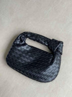 Vlechtknoop Neplederen Mini Tas Met Geweven Ontwerp En Gedraaide Handgreep Voor Elegante En Moderne Stijl